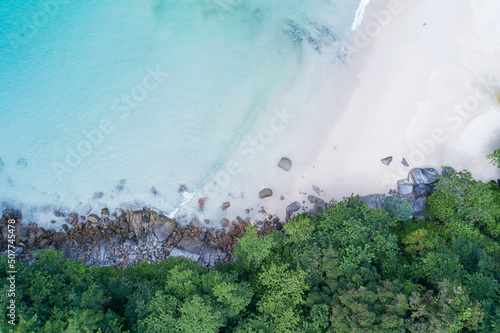 Aerial view Top down seashore wave crashing on seashore Beautiful turquoise sea surface in sunny day Good weather day summer background Amazing beach top view
