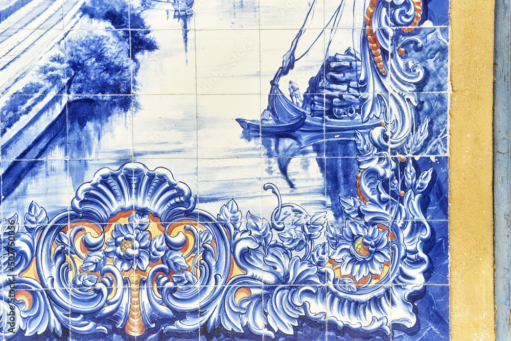 Portuguese Azulejos tiles, depicting typical regional scenes and monument on the facade of Santarem market, Portugal