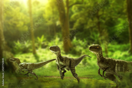Foto Dinosaurs, velociraptors in the jungle