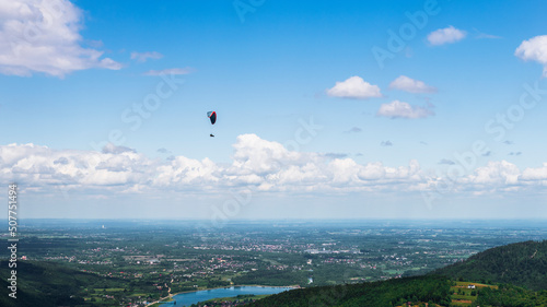 Fototapeta Naklejka Na Ścianę i Meble -  Paraglider in the sky. view from the top of Żar in the Beskid Mały.