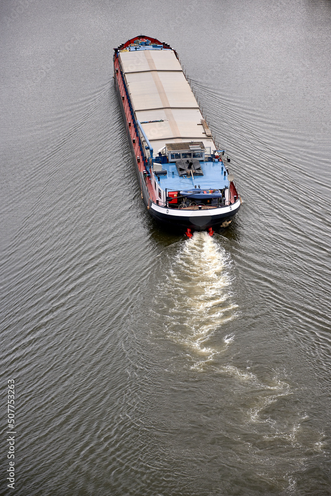 vessel transporting gravel sand on a river