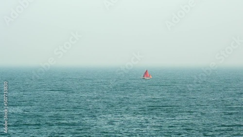 Wallpaper Mural Minimalist Distant red sail historic sailing boat near Torquay in Devon England Torontodigital.ca