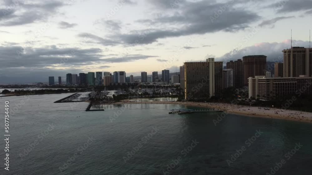 4K cinematic crane drone shot of the Northwest side of Waikiki and the marina in Oahu during sunset. This vibrant Hawaiian scene was filmed using a DJI Mini 2 drone. 4K cinematic crane drone shot of the Northwest side of Waikiki and the marina in Oahu during sunset. This vibrant Hawaiian scene was filmed using a DJI Mini 2 drone.