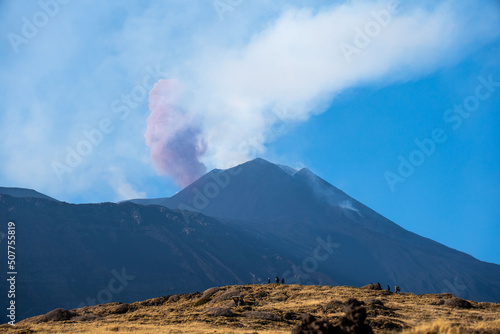 Volcano Etna with smoke in a sunny day in Sicily