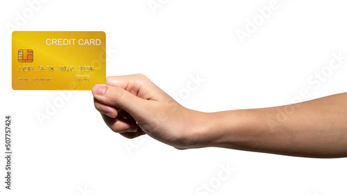 The woman's hand holds a gold credit card isolated on white background.