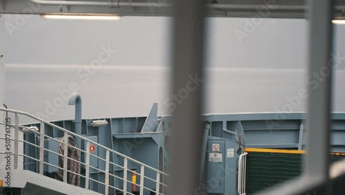 View from the upper deck of the passenger ferry crossing the Hardanger fjord. Slow-motion, pan follow. photo