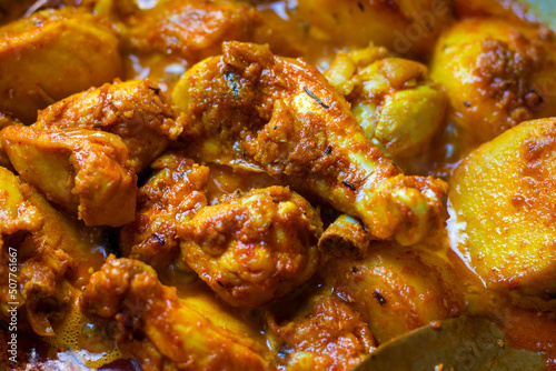 selective focus of delicious Indian chicken curry in Bengali style.