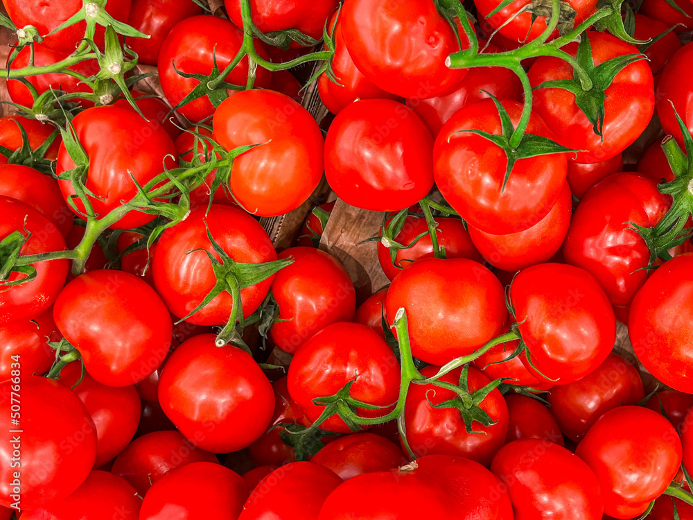 tomato green branch cherry tomatoes fruit market store healthy meal food diet snack on the table copy space food background rustic top view keto or paleo diet veggie vegan tomato green branch cherry tomatoes fruit market store healthy meal food diet snack on the table copy space food background rustic top view keto or paleo diet veggie vegan