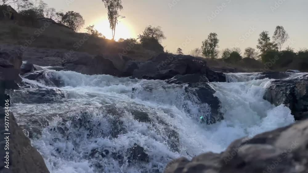 Water Flowing In The Waterfalls At Sunset. - handheld Water Flowing In The Waterfalls At Sunset. - handheld