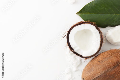 Coconut on white background. Home spa treatment concept, organic cosmetic. Copyspace.