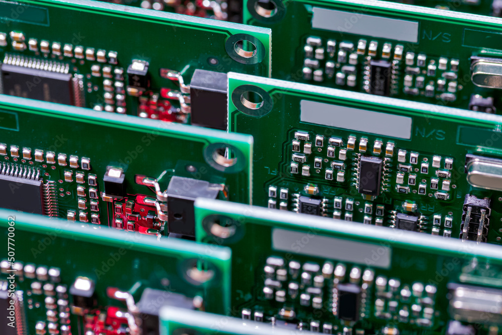 Electronics Industry Concepts. Closeup of Batch or Line of Ready ABS Automotive Printed Circuit Boards with Soldered Surface Mounted Components.