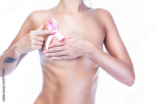 Caucasian Topless Woman With Folded Hands Holding Pink Solidarity Ribbon As Breast Cancer Awareness Symbol and Women Healthcare Concept of Campaign Against Cancer.