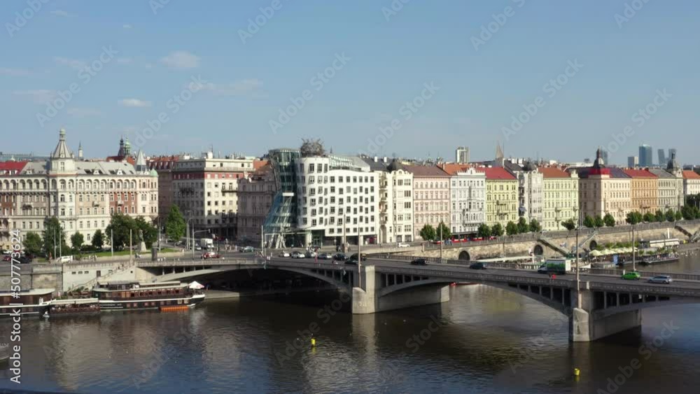Dancing house and Vltava river embankment with Jirásek bridge, Prague. Dancing house and Vltava river embankment with Jirásek bridge, Prague.