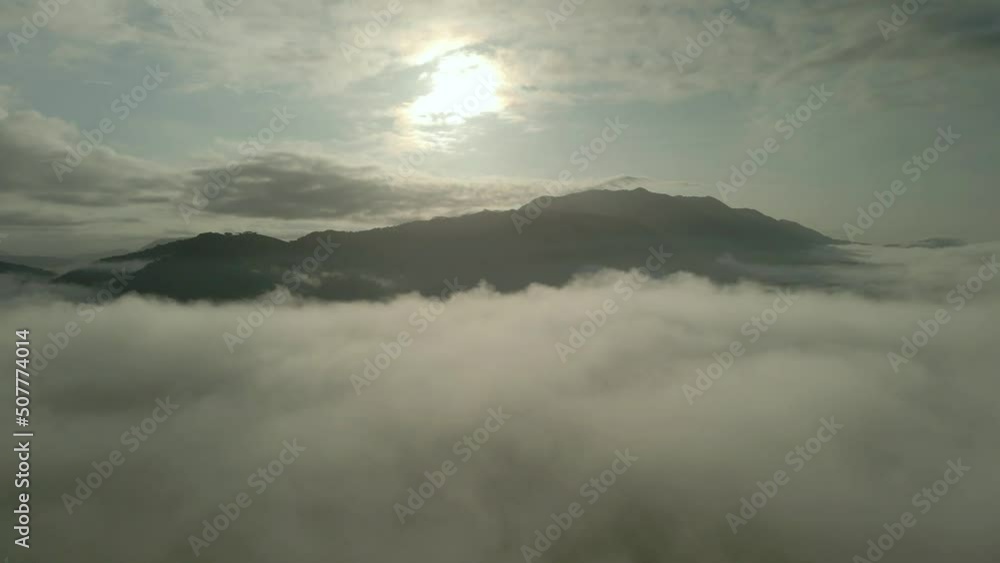 Foggy and sunrise rays shining through in autumn mountains. misty in nature. landscape clips of costa rica Foggy and sunrise rays shining through in autumn mountains. misty in nature. landscape clips of costa rica
