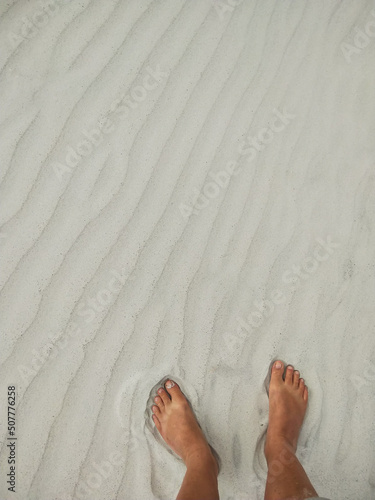 Summer feet in sand