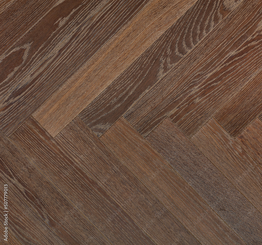 Dark wood planks with a vibrant brown texture create a symmetrical herringbone pattern. Dark wood planks with a vibrant brown texture create a symmetrical herringbone pattern.