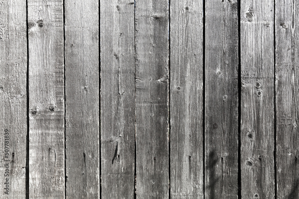 Old grungy gray wooden wall, front view Old grungy gray wooden wall, front view