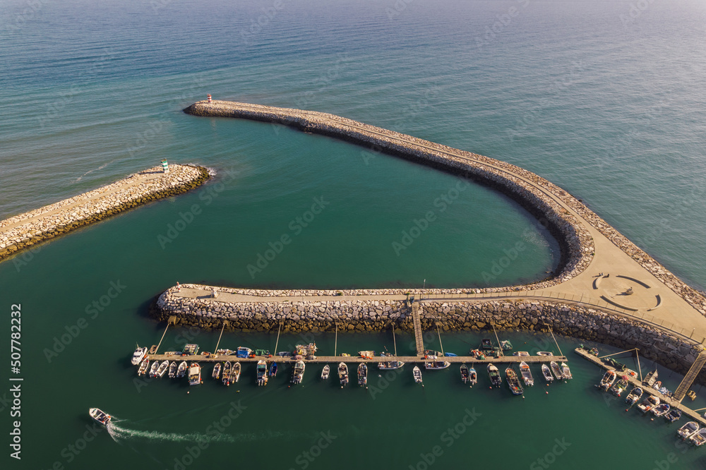 Aerial view of entrance of fishing port at Quarteira, Algarve, Portugal