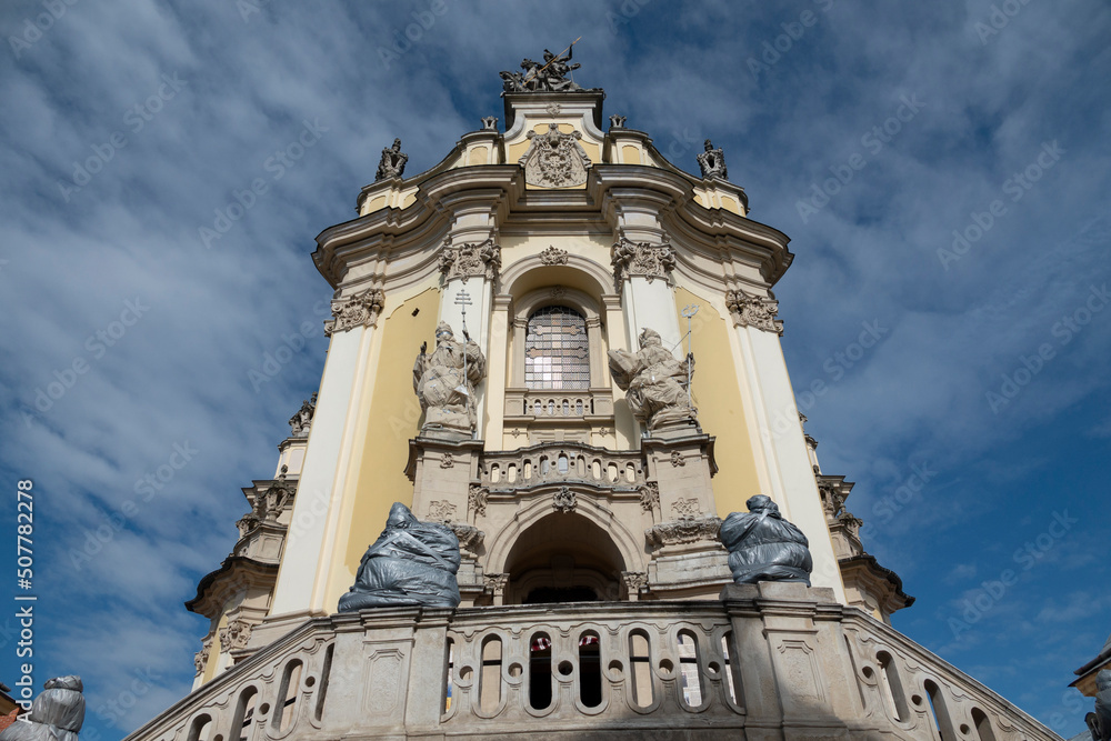 Lviv, Ukraine. Statues on the entrance St. George's Cathedral protected in case of missile strike.