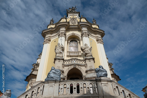 Lviv, Ukraine. Statues on the entrance St. George's Cathedral protected in case of missile strike. photo