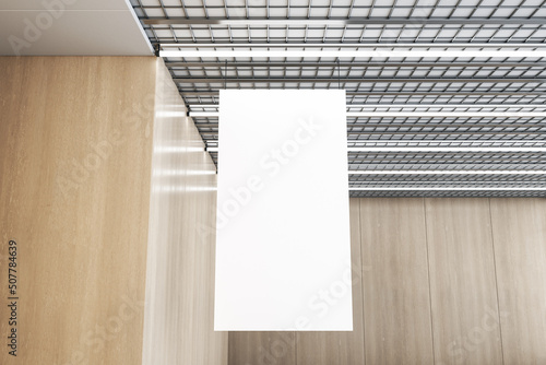 Fotografie Close up of empty white stopper hanging in wooden interior with industrial ceiling
