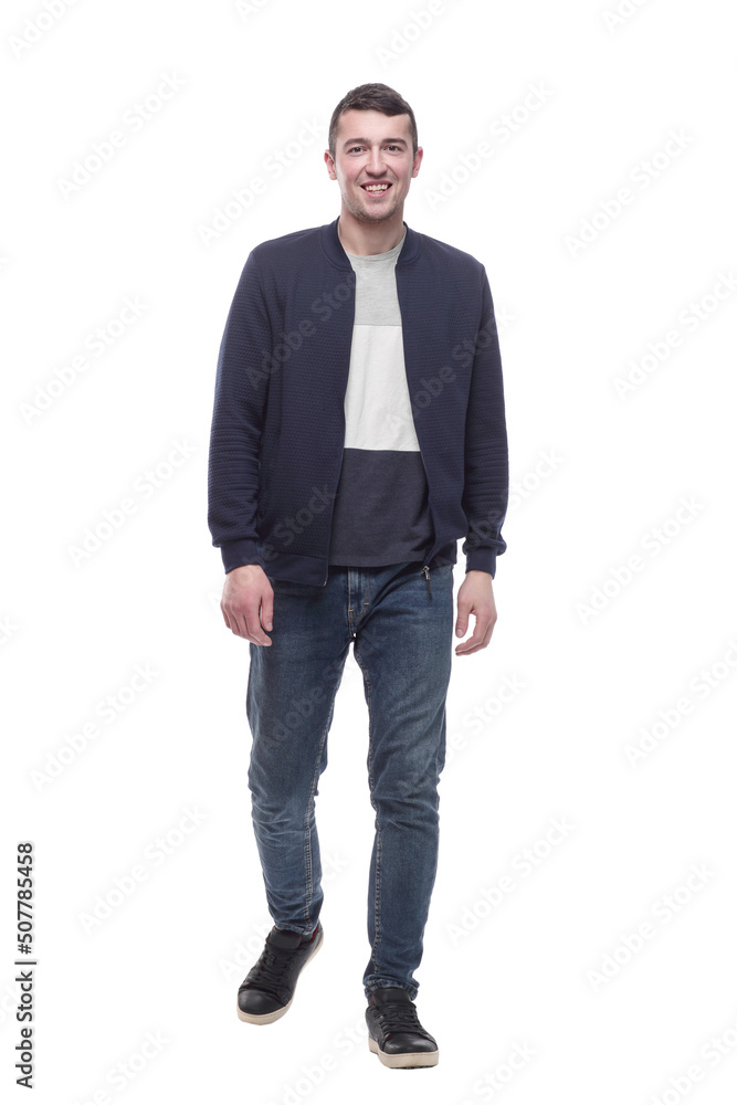 young man in jeans striding forward . isolated on a white young man in jeans striding forward . isolated on a white