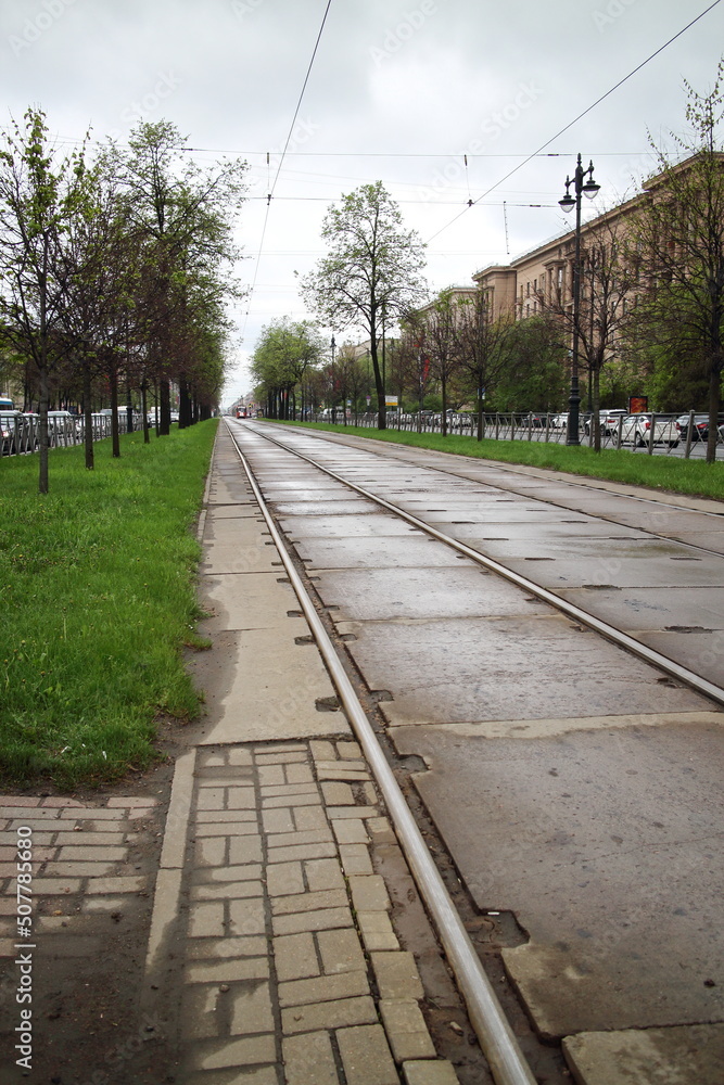 Fototapeta premium tram tracks on the avenue in the city in spring