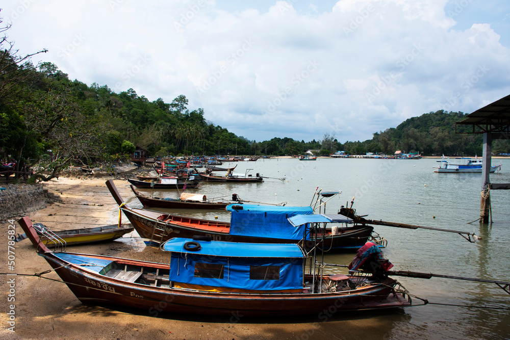 View landscape seascape and local thai fisher people floating stop boat ship in sea waiting catch fish and marine life at Pak Bara fishing village at La ngu city on April 12, 2022 in Satun, Thailand