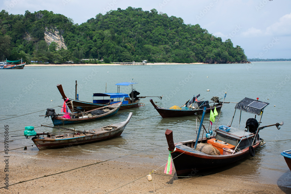 View landscape seascape and local thai fisher people floating stop fishing boat ship in sea waiting catch fish and marine life at waterfront Pak Bara fishing village at La ngu city of Satun, Thailand