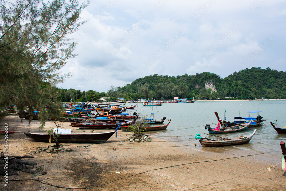 View landscape seascape and local thai fisher people floating stop fishing boat ship in sea waiting catch fish and marine life at waterfront Pak Bara fishing village at La ngu city of Satun, Thailand