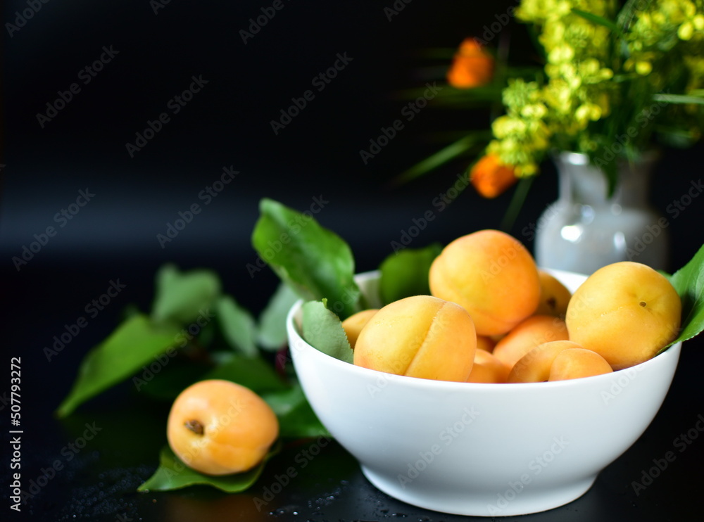 still life with apricots on a dark background still life with apricots on a dark background