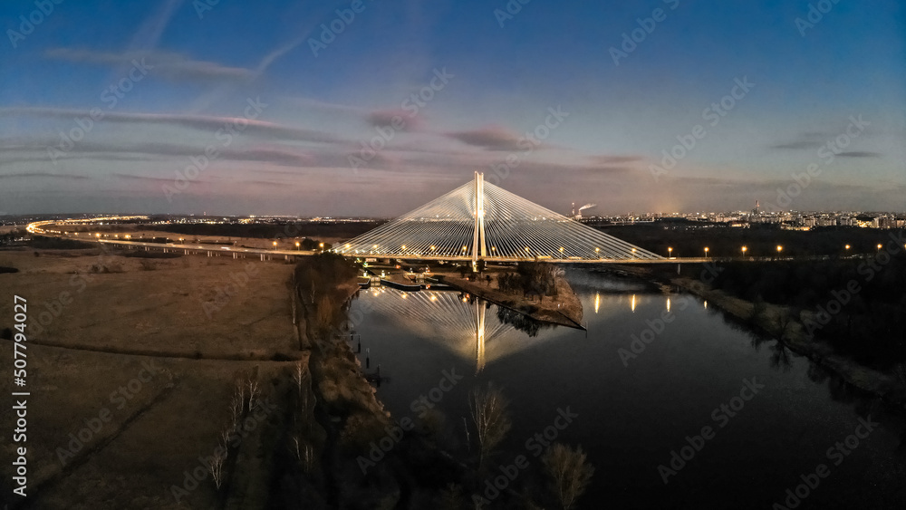 Most Rędziński na obwodnicy A8, S8 nocą z lotu ptaka drona z miastem w tle - obrazy, fototapety, plakaty 
