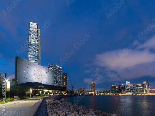 Night scenery of West Kowloon Cultural District and Victoria harbor in Hong Kong city