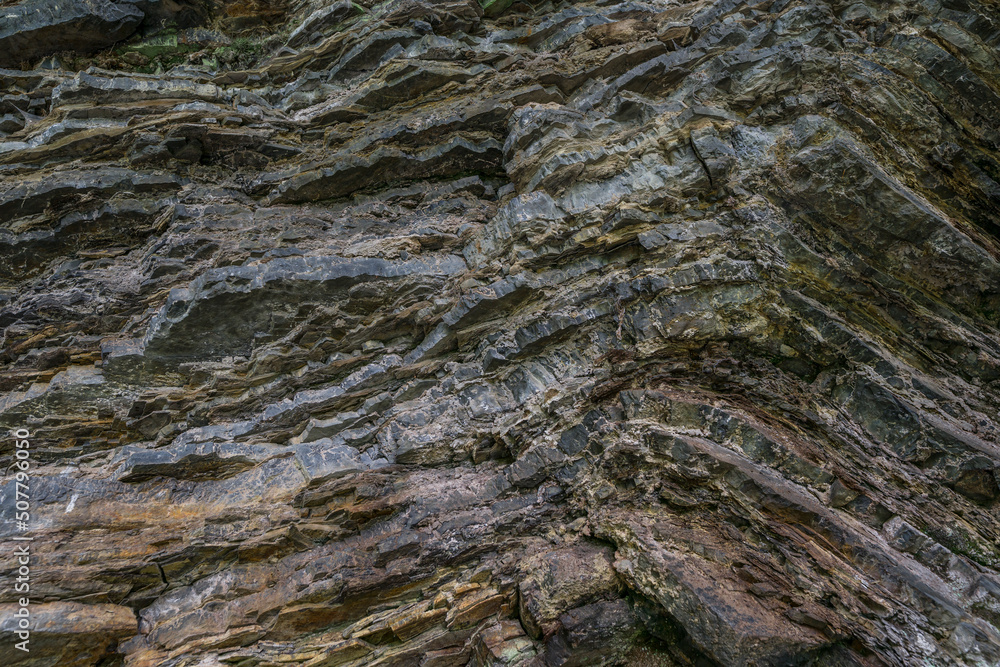 Granite rock wall texture. Mountain stone geological layers Granite rock wall texture. Mountain stone geological layers