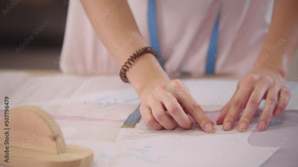 Women's hands works with fabric samples on the table Women's hands works with fabric samples on the table