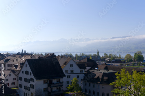 Wallpaper Mural Aerial view of the old town of City of Rapperswil with Swiss Alps in the background on a sunny spring day. Photo taken April 28th, 2022, Rapperswil-Jona, Switzerland. Torontodigital.ca