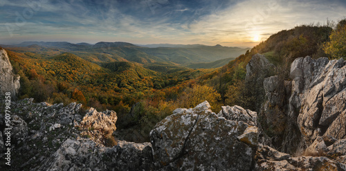 Top of hill Vapenna in Carpathians during sunset with rocks