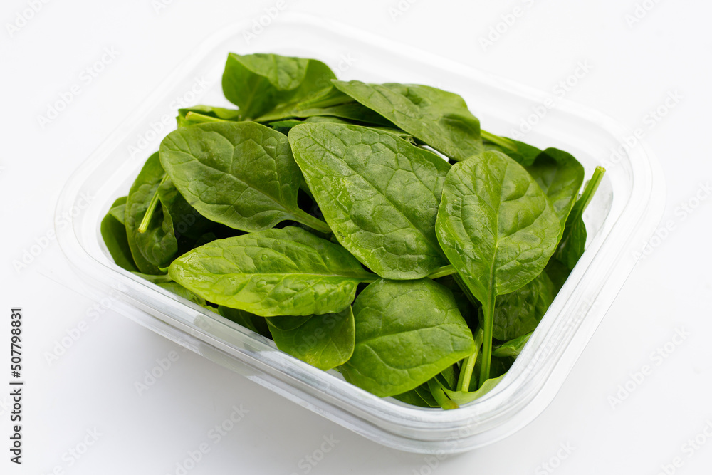 Spinach leaves on white background. Spinach leaves on white background.