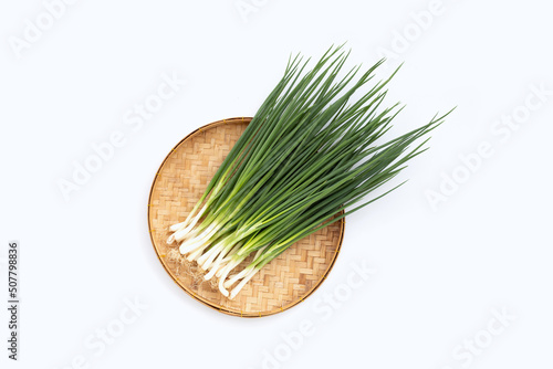 Spring onions on white background photo