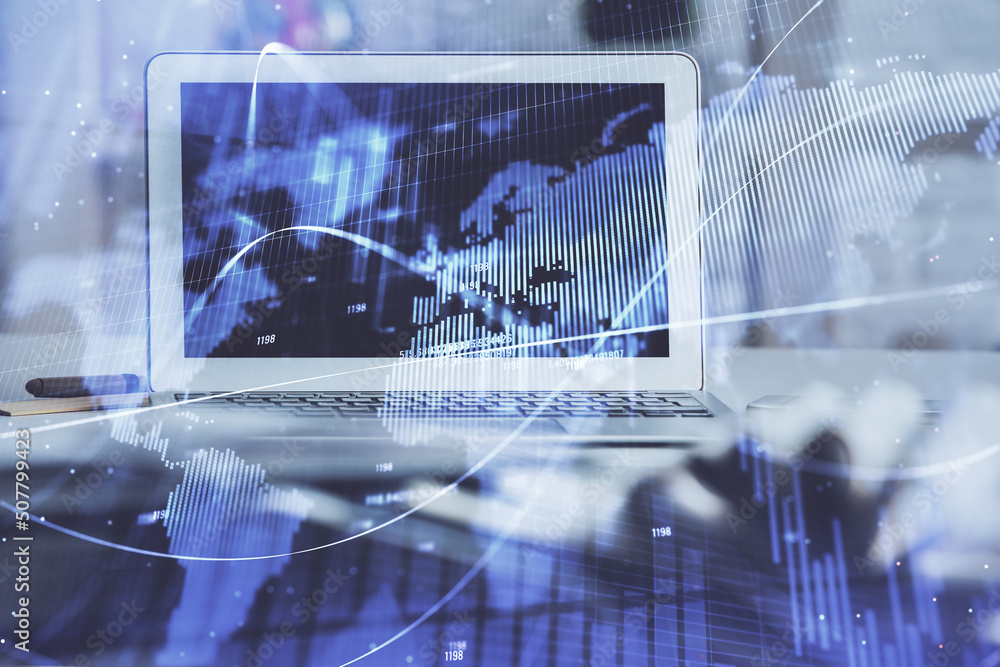 Forex market graph hologram and personal computer on background. Multi exposure. Concept of investment. Forex market graph hologram and personal computer on background. Multi exposure. Concept of investment.