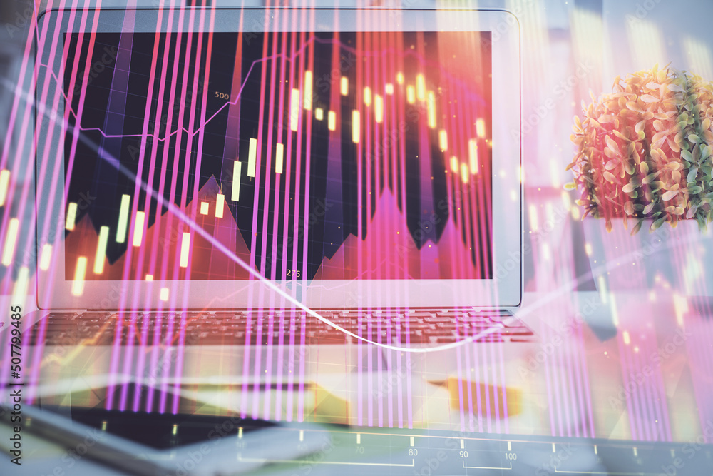 Forex market graph hologram and personal computer on background. Multi exposure. Concept of investment.