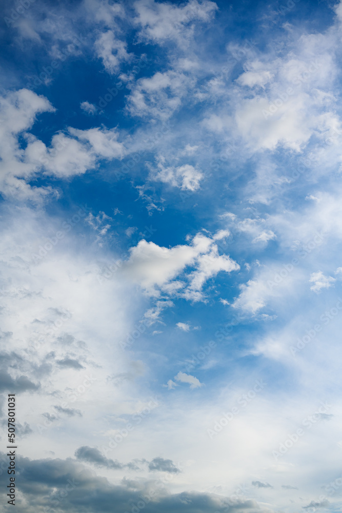 Fototapeta premium Dramatic blue sky with white clouds.