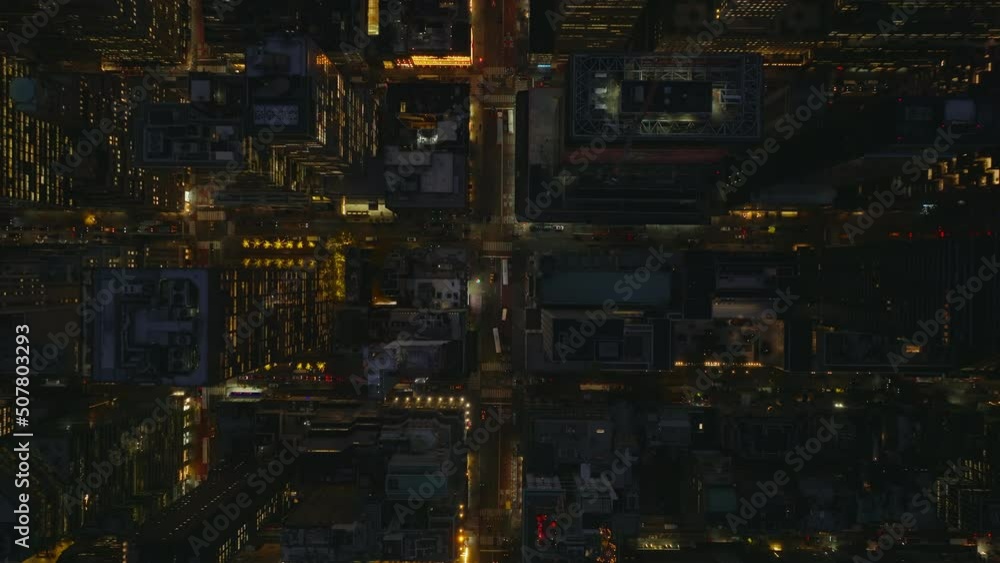 Aerial birds eye overhead top down view of streets in city centre. Downtown at night from height. Manhattan, New York City, USA Aerial birds eye overhead top down view of streets in city centre. Downtown at night from height. Manhattan, New York City, USA