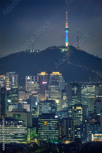 Photography Seoul downtown cityscape illuminated with lights and Namsan Seoul Tower in the evening view from Inwang mountain