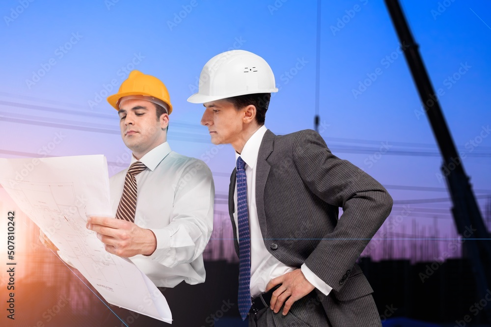Happy construction engineer posing on construction site Happy construction engineer posing on construction site