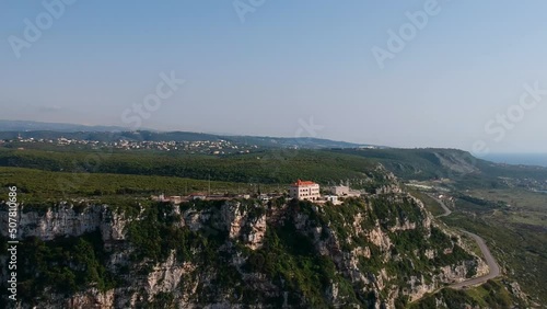 Aerial Shot Of High Rise Green Mountain, Clear Blue Sky, Chekka, Lebanon photo