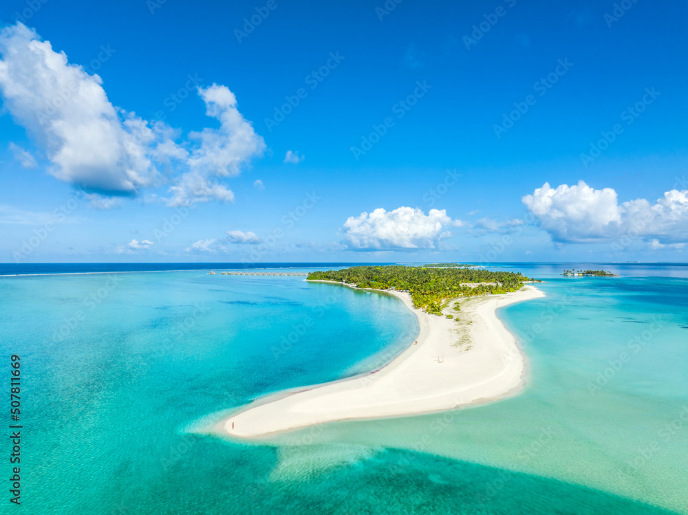 Fototapeta premium Maldives paradise scenery. Tropical aerial landscape, seascape with long jetty, water villas with amazing sea and lagoon beach, tropical nature. Exotic tourism destination banner, summer vacation