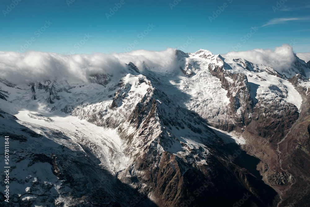 Snowy winter mountains with valley in Caucasus region in Russia