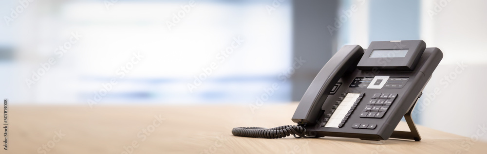 Close up telephone landline at office concept Communication support, call center and customer service help desk.for (call center) concept. Close up telephone landline at office concept Communication support, call center and customer service help desk.for (call center) concept.