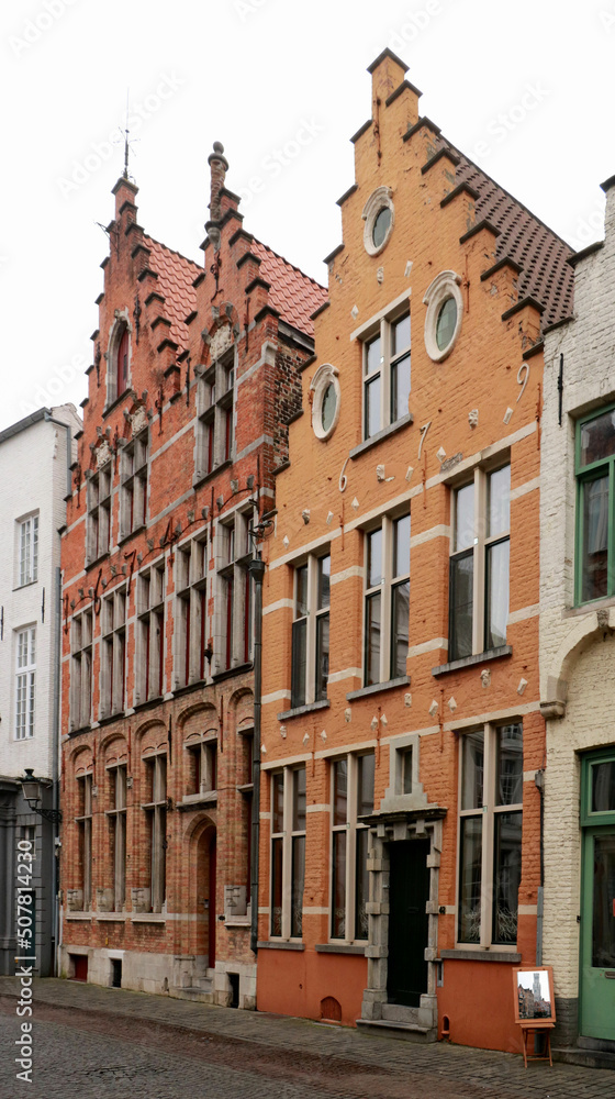 ancient houses with gabled facades in the medieval part of the town Bruges, Belgium